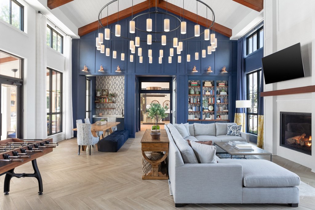 Large Resident lounge with foosball table, sectional couch, and fireplace.