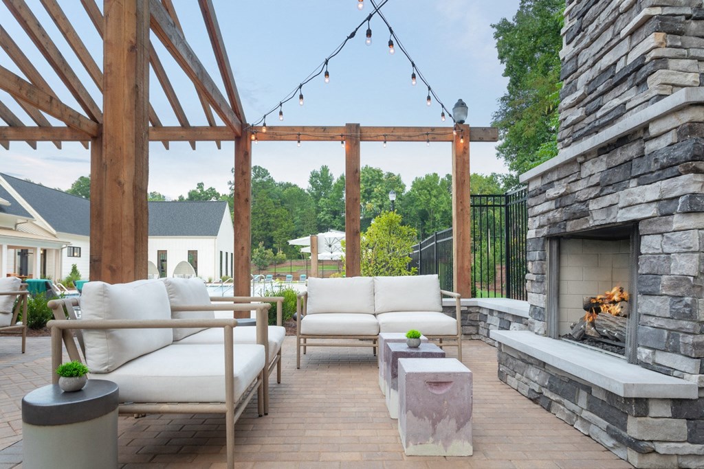 Outdoor firepit with cozy furniture.