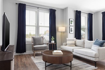 Large, well lit living room with hardwood floors. - Photo Gallery 3