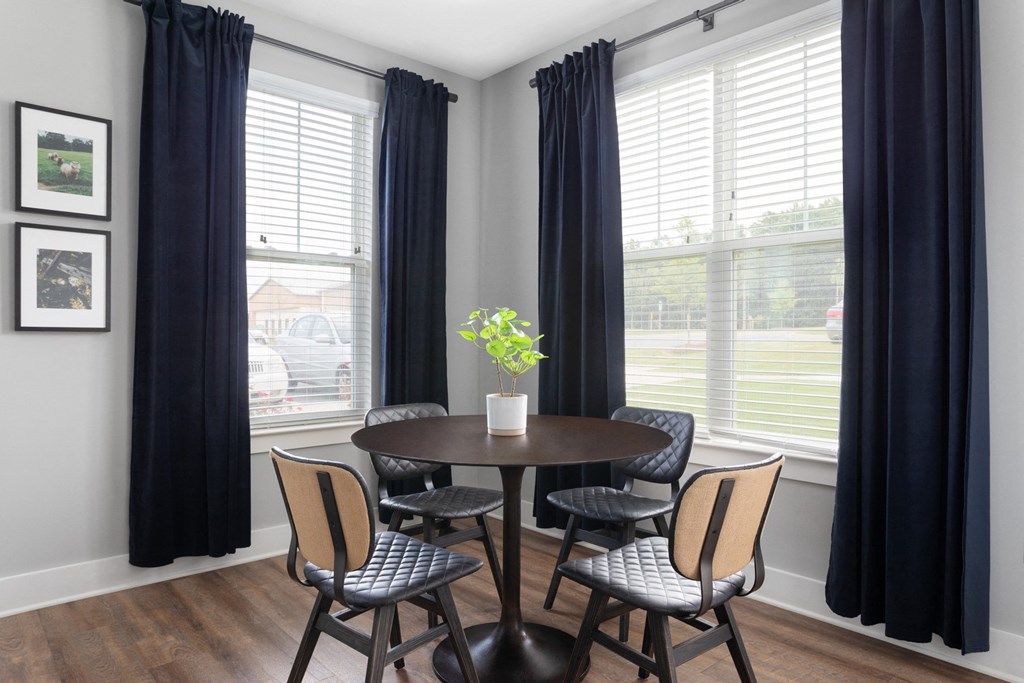Dining room with large corner windows.