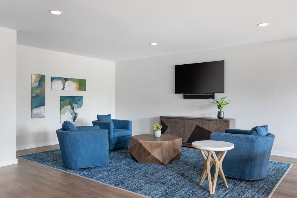 interior reisdent clubhouse lounge with seating and tv