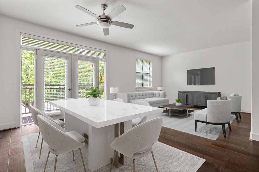 an open living room and dining room with a white table and chairs