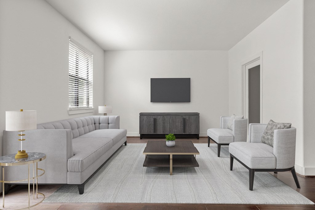 a living room with couches and chairs and a tv on the wall