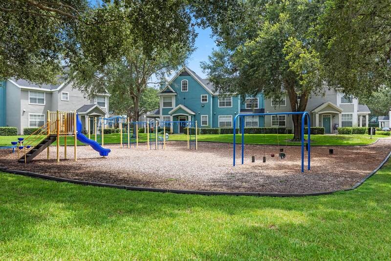 a playground with a slide and monkey bars