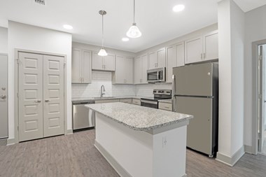 Kitchen with island and stainless appliances
