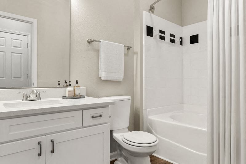 a bathroom with a toilet sink and bathtub
