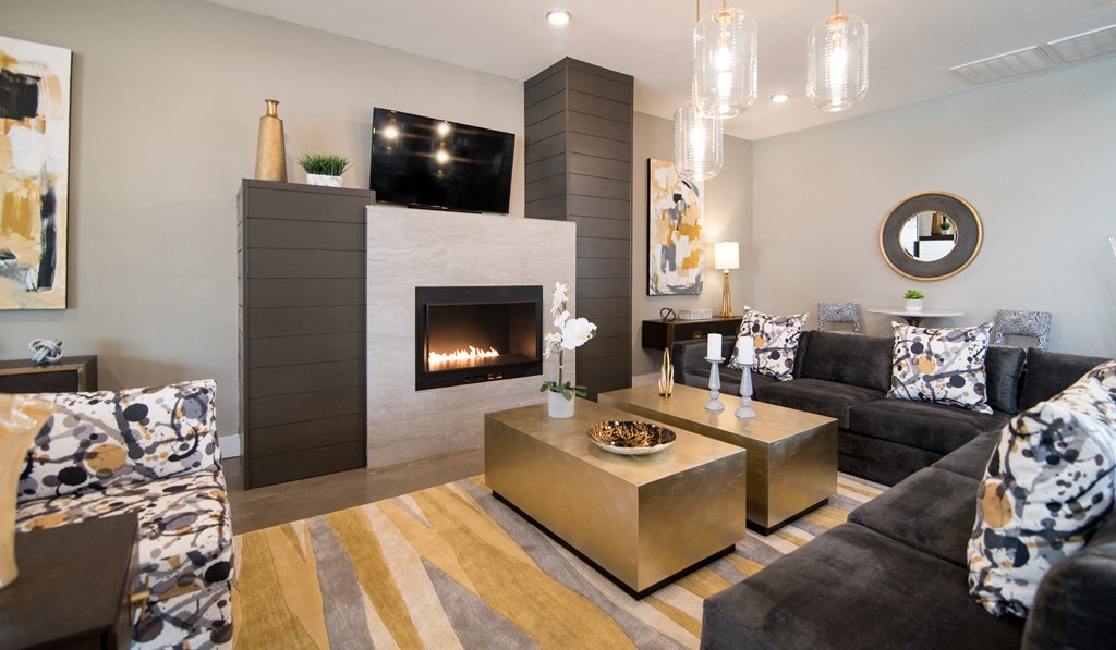 a living room with a fireplace and couches