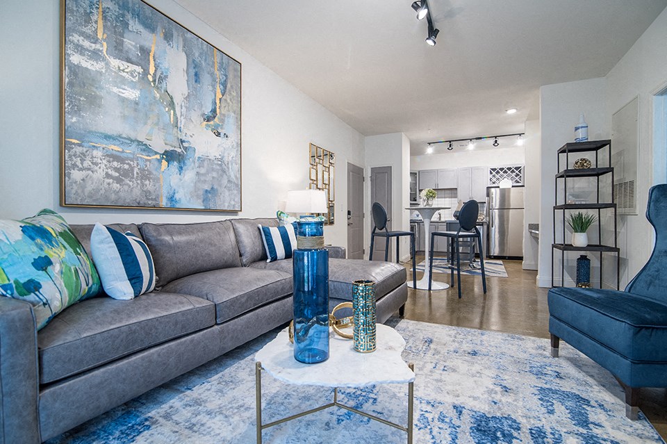model living room with a couch and a picture frame above the couch