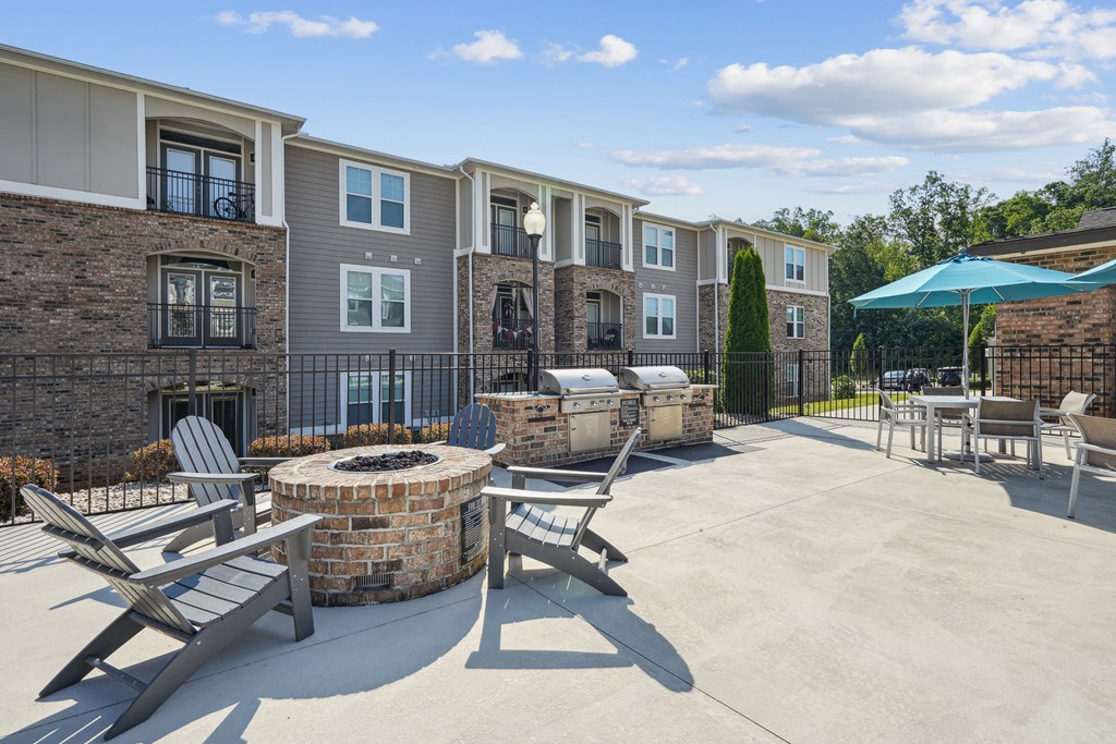 our apartments have a large patio with a fire pit