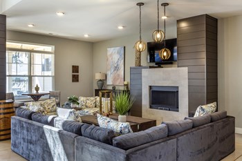 interior clubhouse resident lounge with seating and tv - Photo Gallery 12