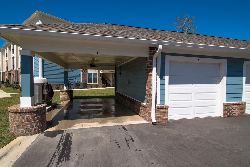 a blue house with a white garage door