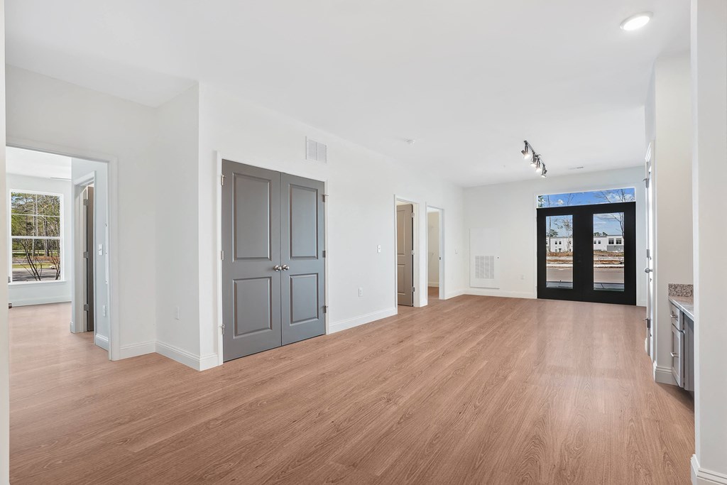 a living room with a hard wood floor and