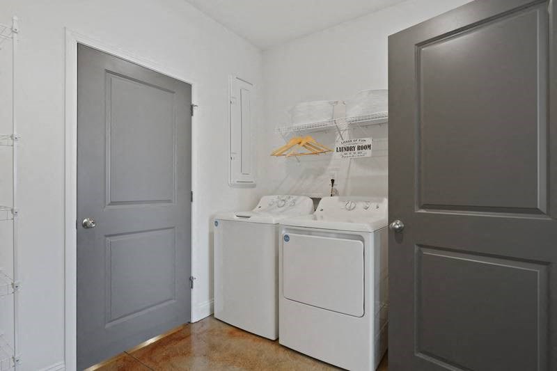 a small laundry room with a washer and dryer