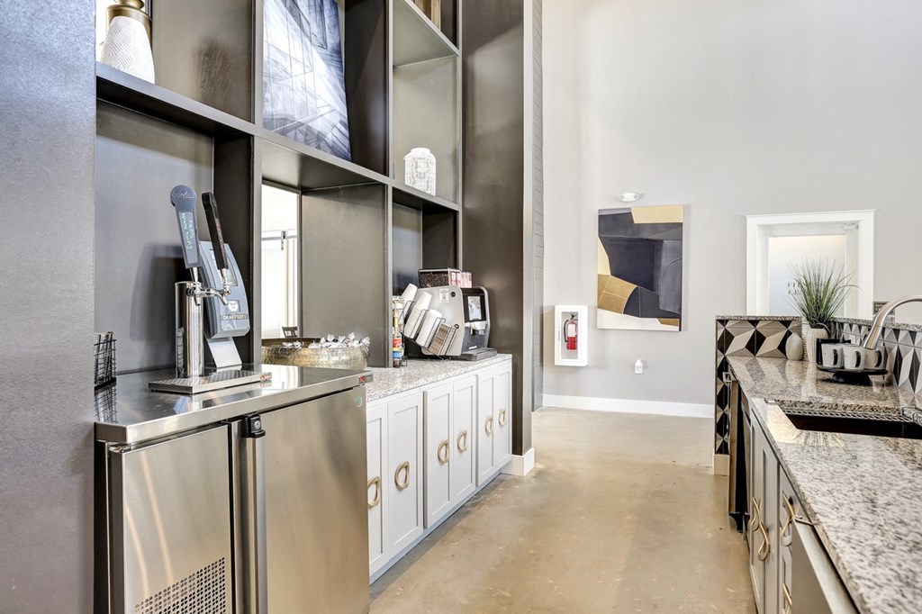 a clubhouse with stainless steel appliances and counter tops