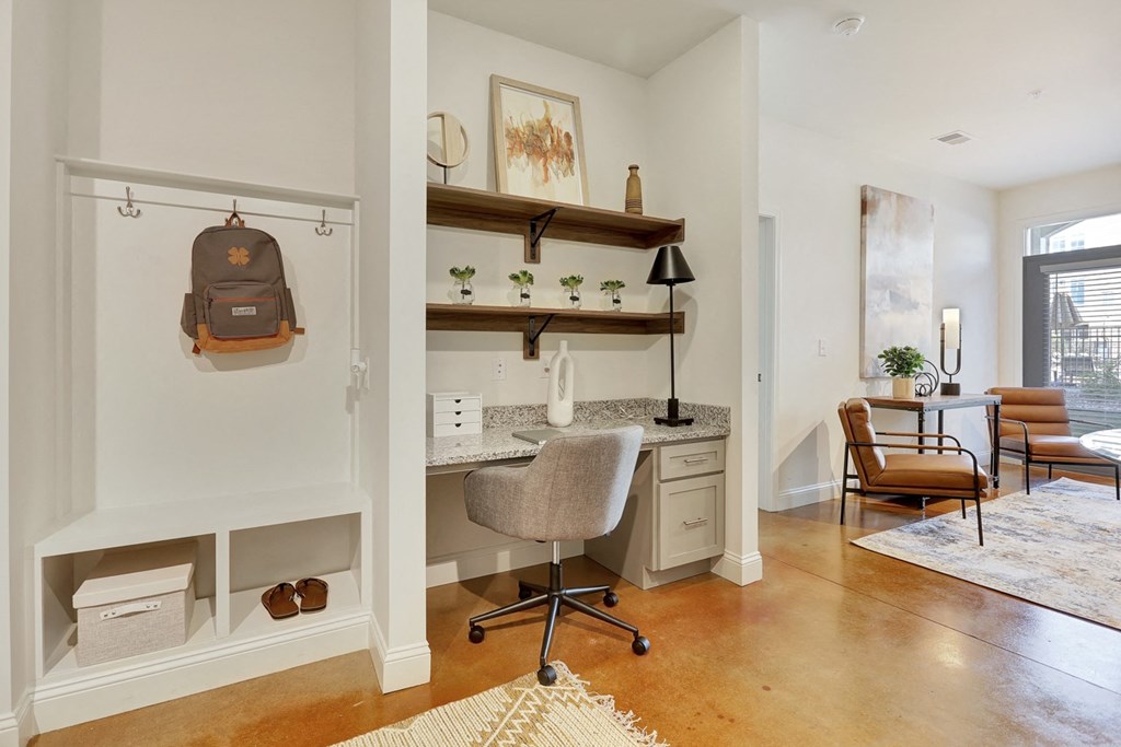 a built in desk with a desk and a chair