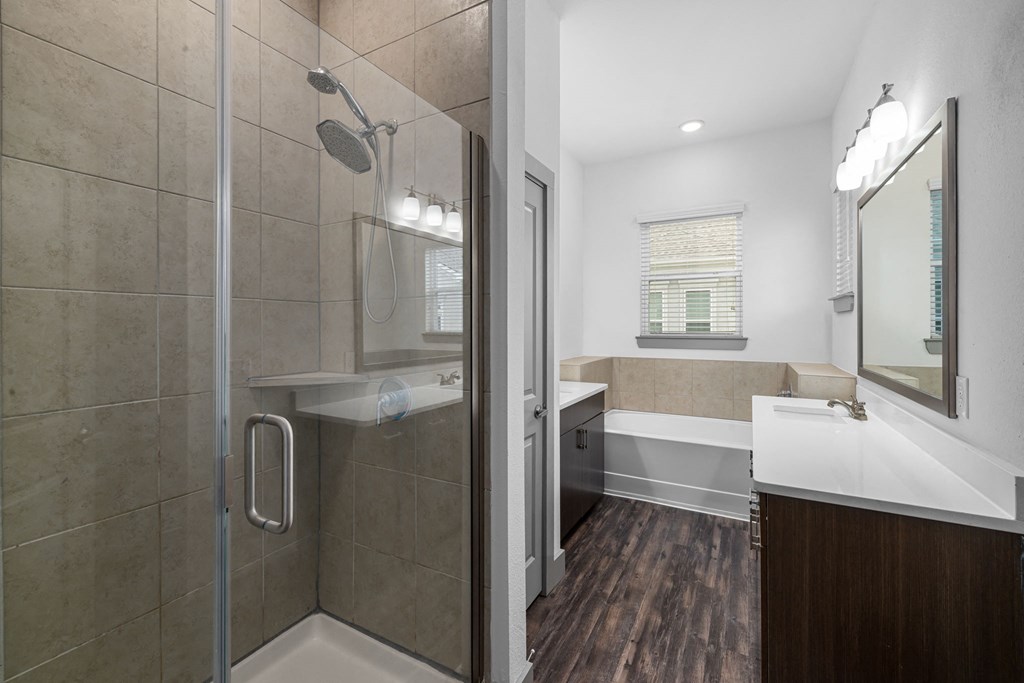 a bathroom with a shower and a sink