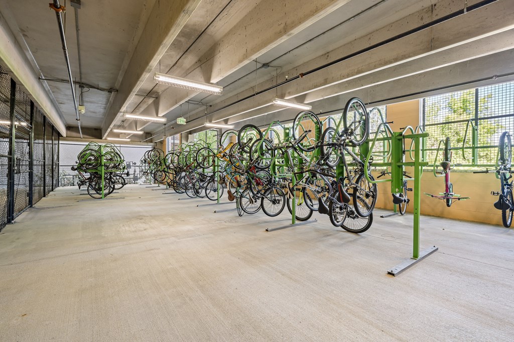 the building has a large bike rack with bikes parked on it