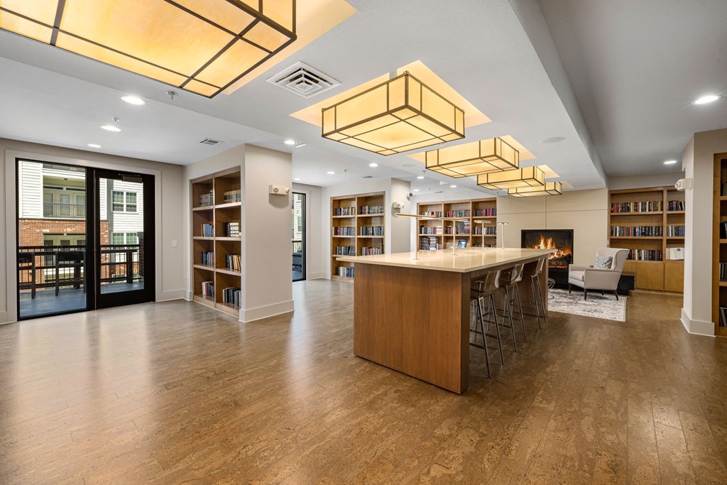a large room with a fireplace and a large table with chairs