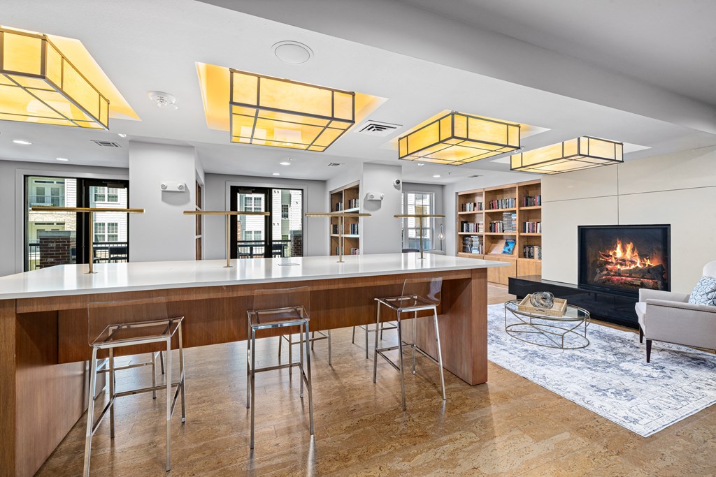 a kitchen with a bar and a fireplace