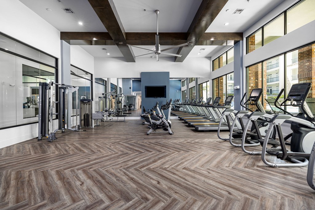 gym with treadmills and other exercise equipment
