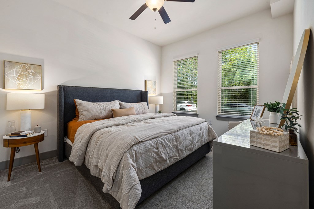 large bedroom with bed and dresser