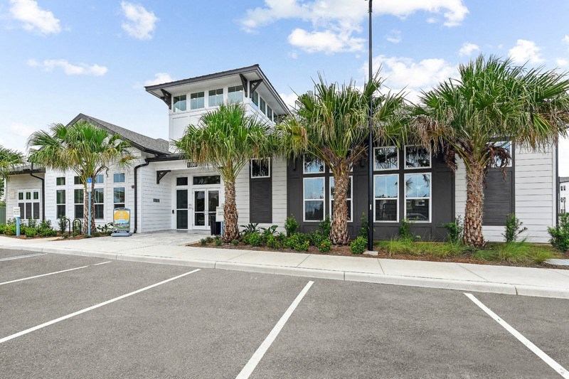 a building with palm trees in front of it