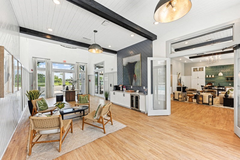 the living room is open to the dining room and kitchen