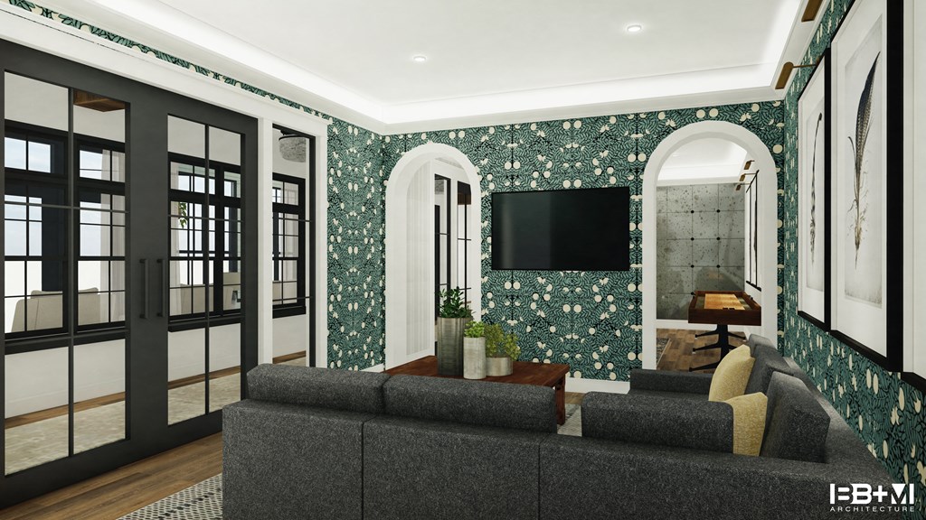 a clubhouse with teal wallpaper and a tv on the wall