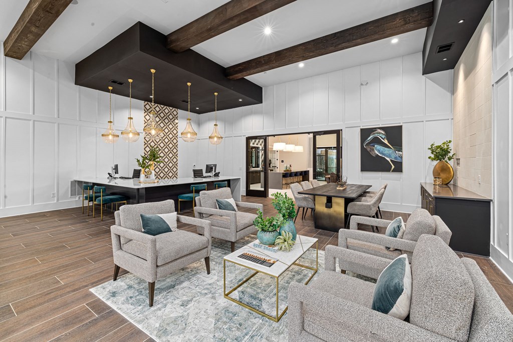 a living room with couches and chairs and a table