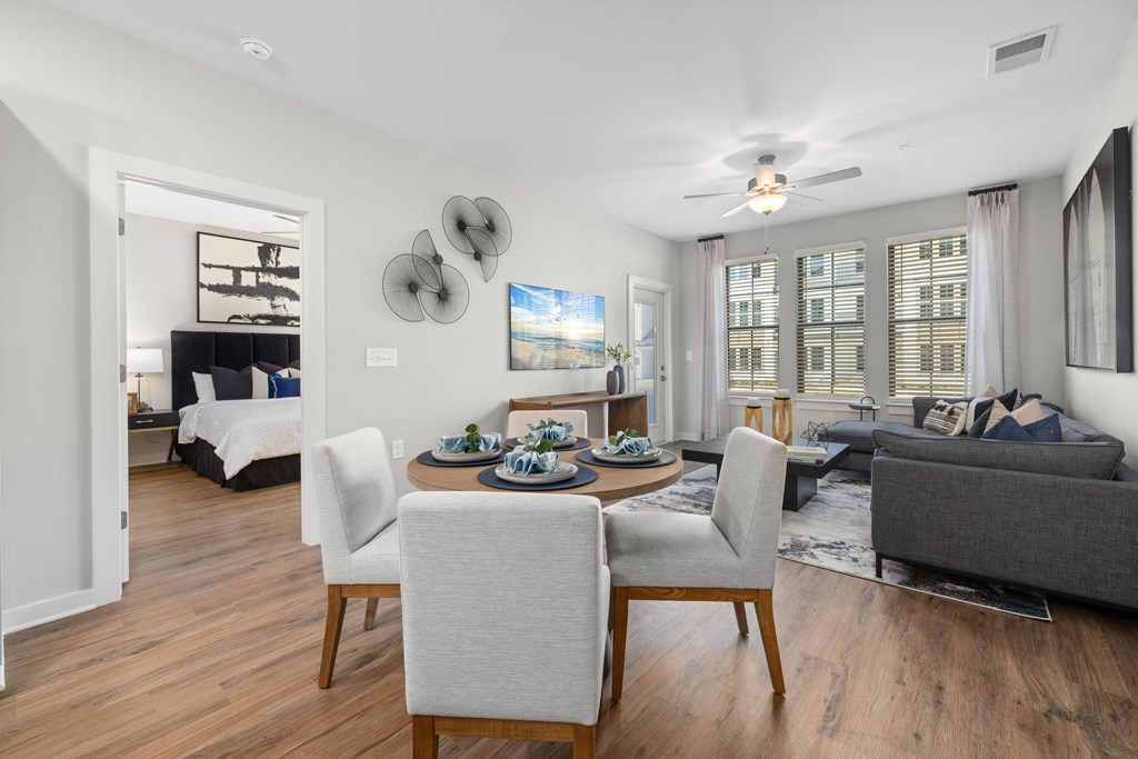 a living room with a couch and a table with chairs