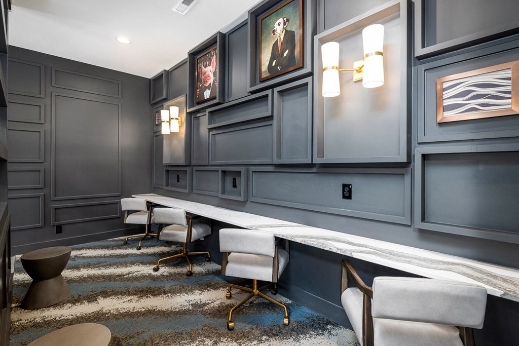 a resident lounge with blue walls and a long table with chairs