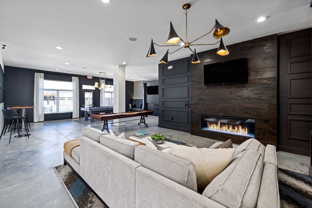 interior resident lounge with a couch and a fireplace