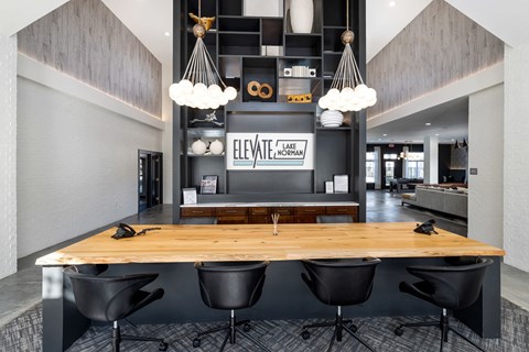 clubhouse entrance with a wooden table and black chairs
