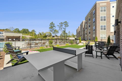 A table and chairs are set up on a patio.