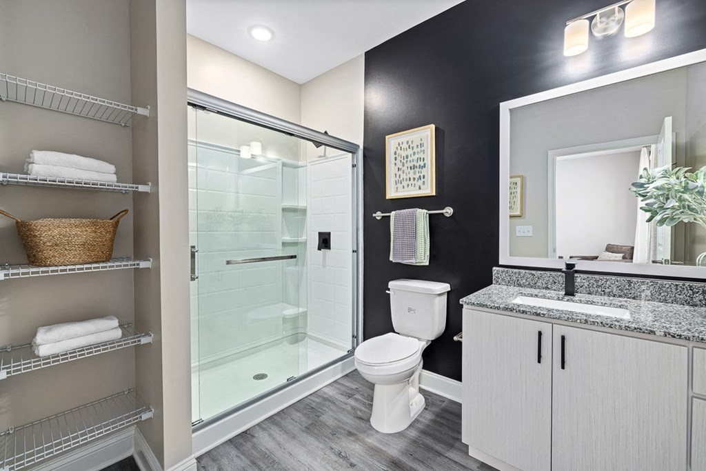 a bathroom with a toilet and a glass shower