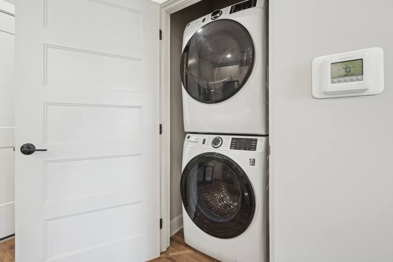 A washing machine is placed in a small room.