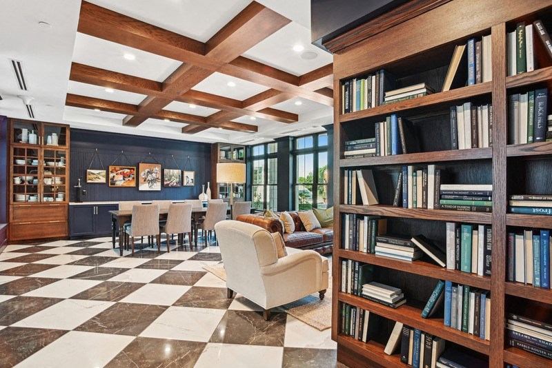 Bookcase with table and chairs in background
