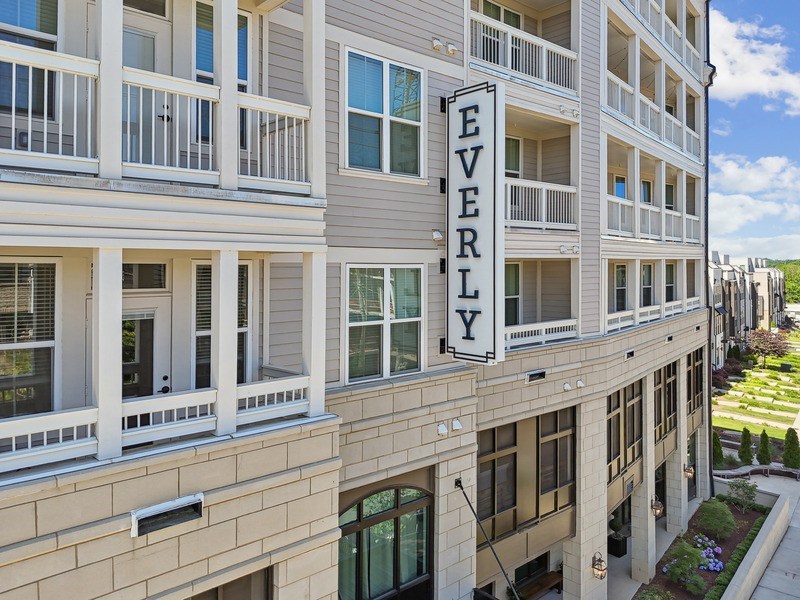 A building with the sign "EVERLY" on the side of it.