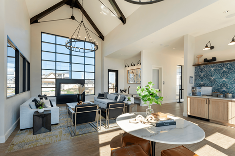 a living room with couches and chairs and a table