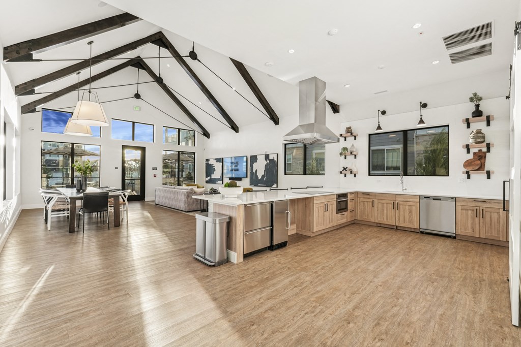 a large kitchen with a large island and a dining room