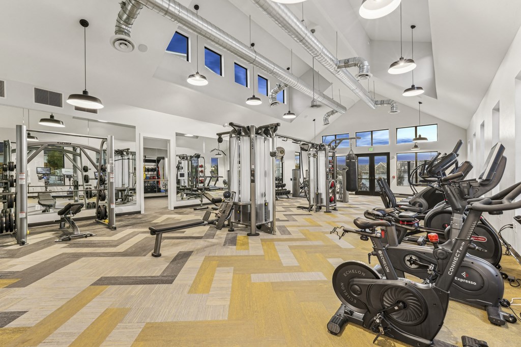 a gym with weights machines and other exercise equipment