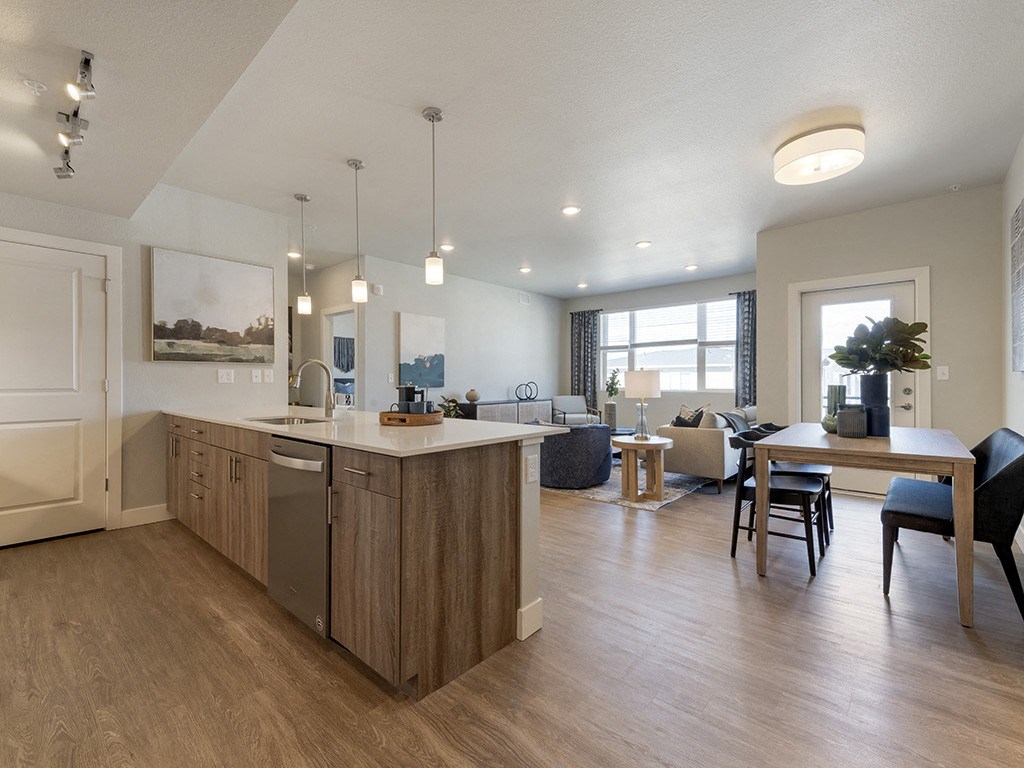 A modern kitchen with wooden cabinets and a large island.