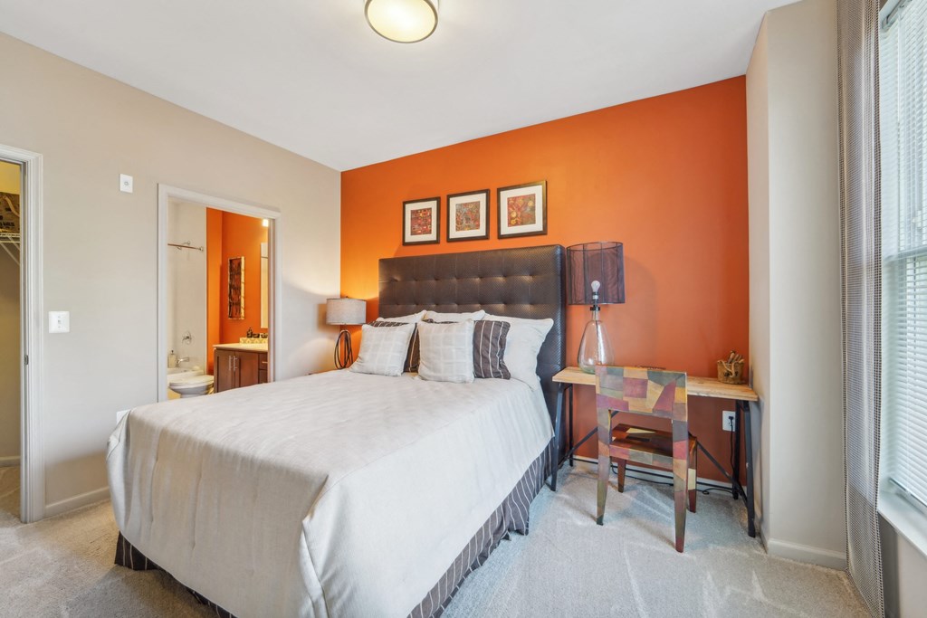 guest bedroom with desk next to bed