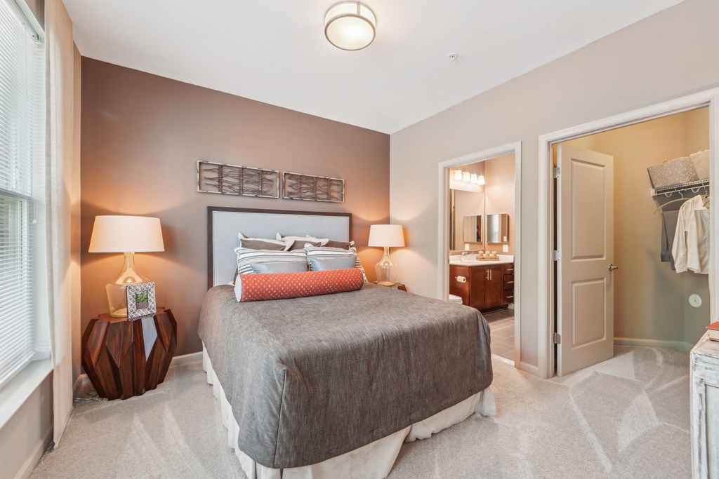 carpeted bedroom with large closet