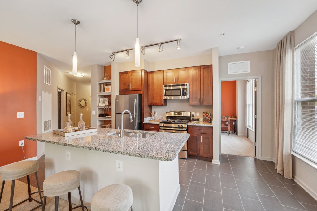 a kitchen with a granite counter top and a sink