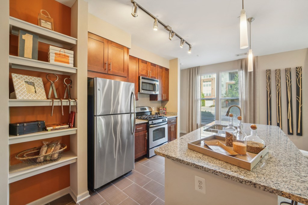 a kitchen with stainless steel appliances and granite counter tops