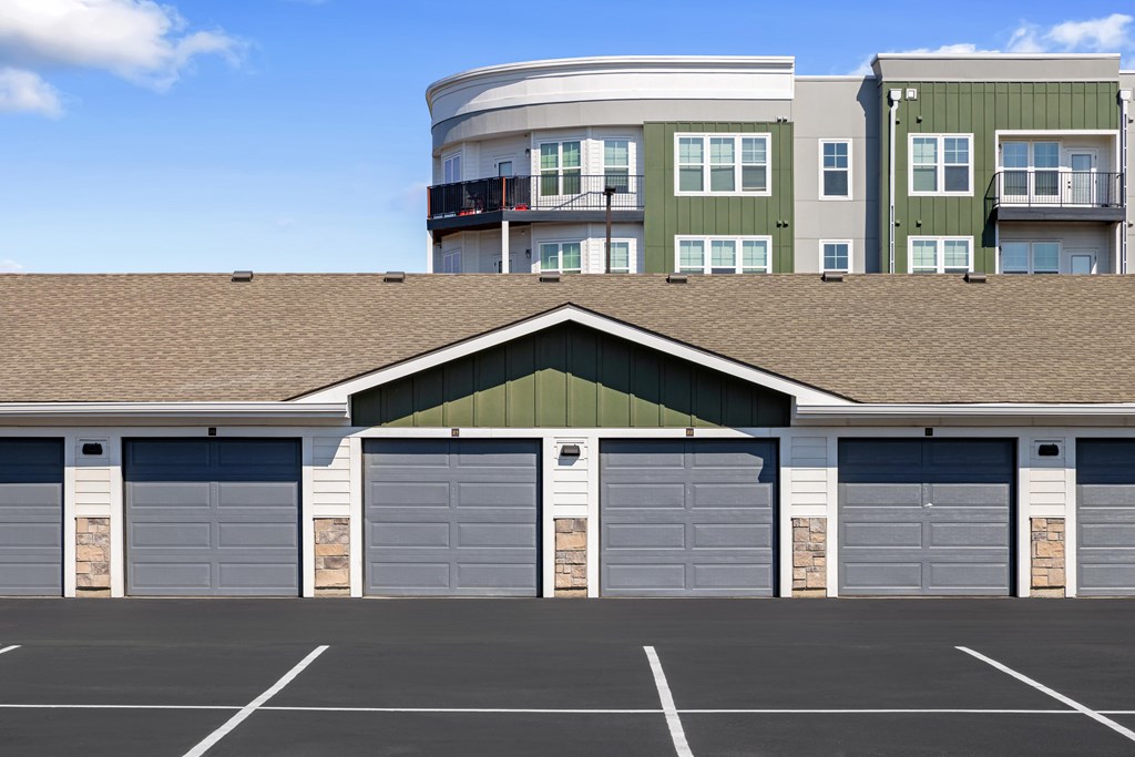 A parking lot with a building in the background.