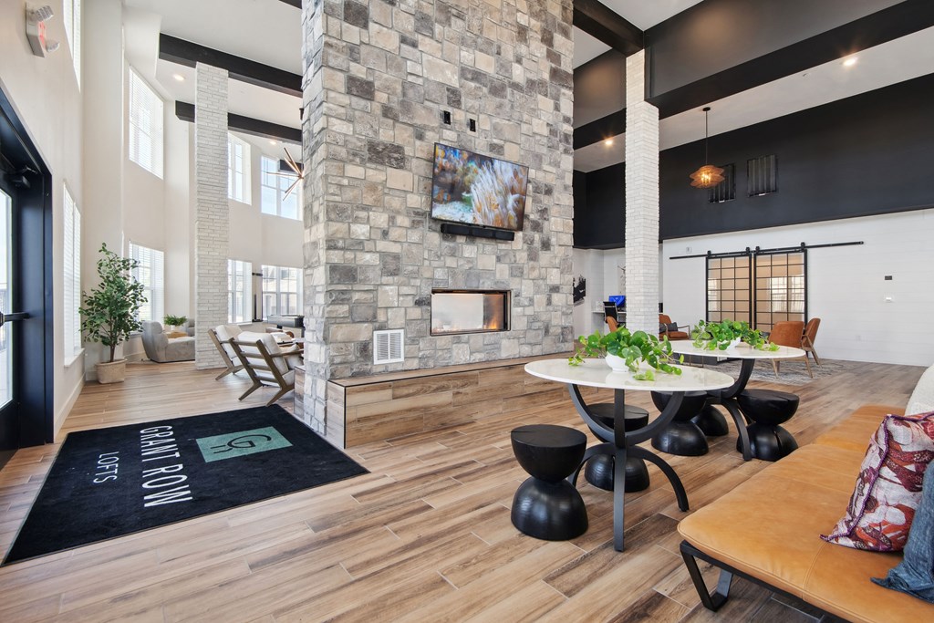 the preserve at ballantyne commons living room with table and fireplace