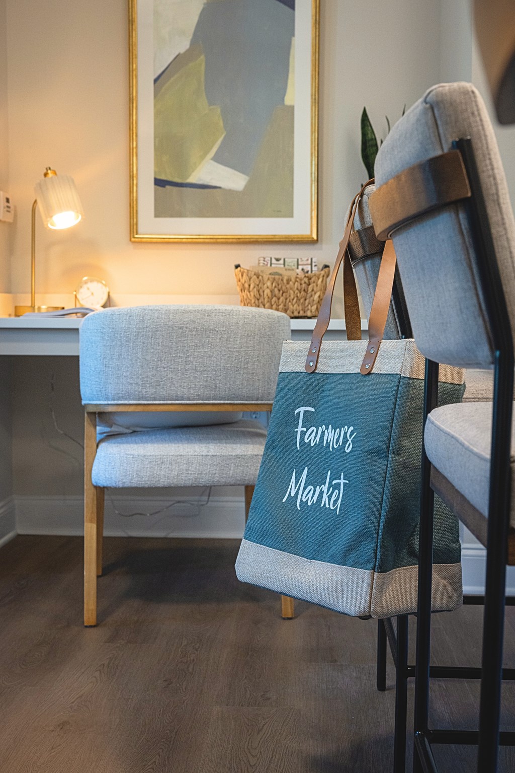 A chair with a bag that says Farmers Market on it.