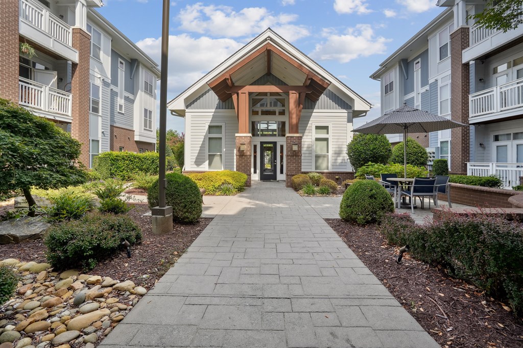 A building with a stone pathway leading to it.